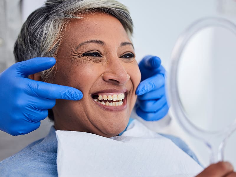 Patient with dentist smiling